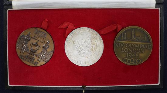 A 1948 Olympics bronze medallion and two 1972 commemorative FA Cup medallions, one in silver, the other bronze
